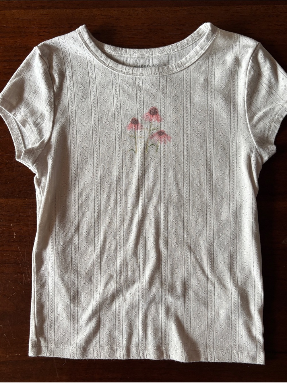 American Eagle white baby tee with pink floral graphic